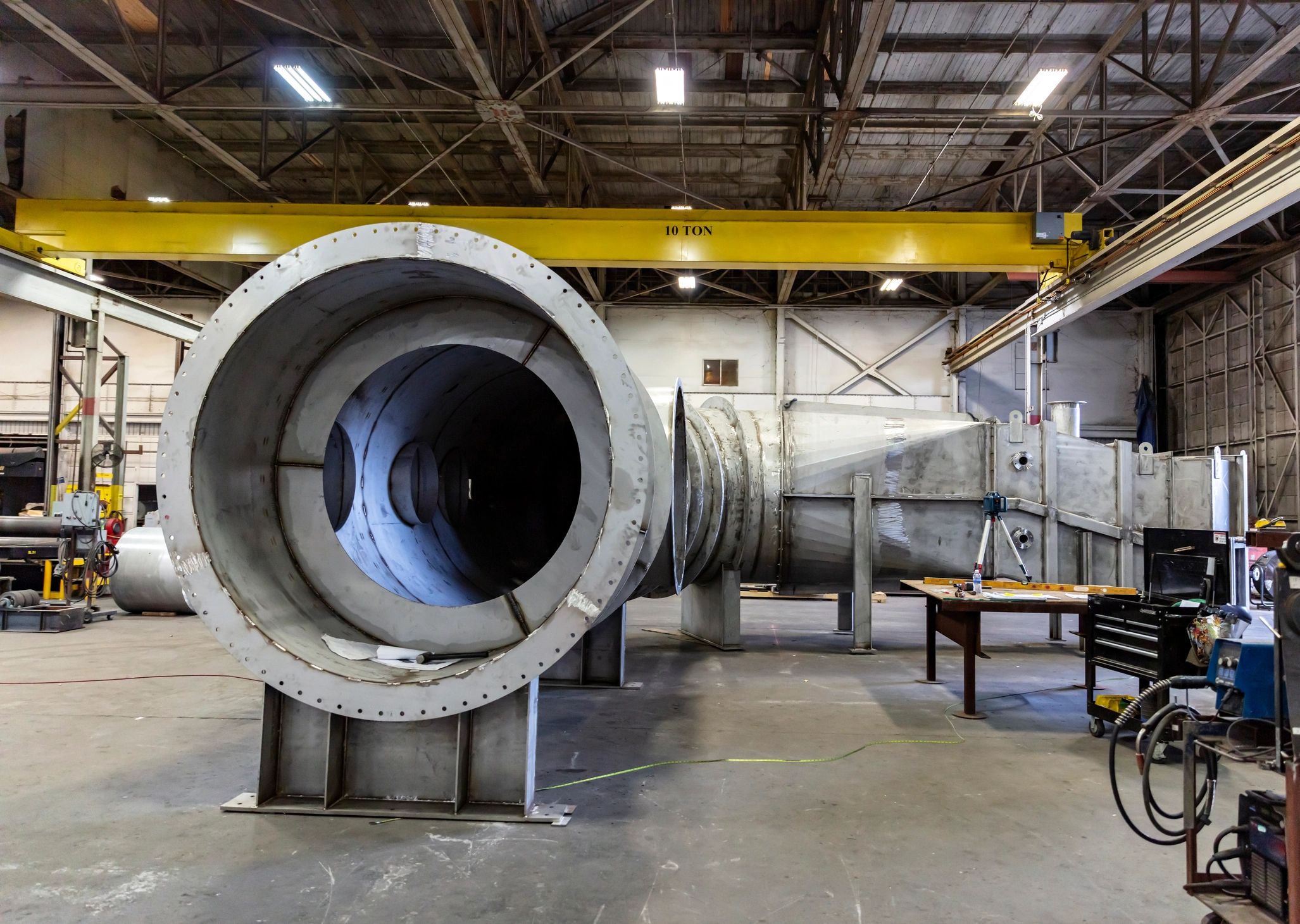 Large-scale scenic fabrication work inside an industrial workshop